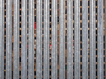 Full frame shot of metal grate against wall