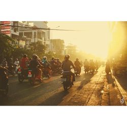 People on road in city against clear sky