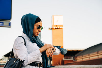 Side view of young woman looking away