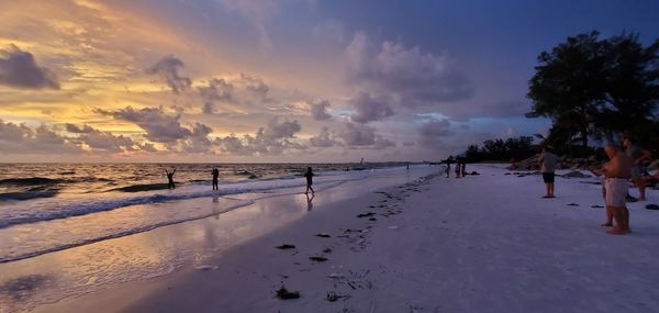 Panoramic view of beach against sky during sunset