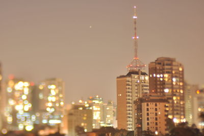 Illuminated buildings in city at night