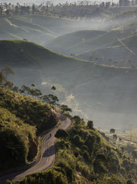 High angle view of road amidst trees and landscape