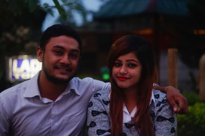 Portrait of smiling couple at park