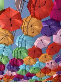 Low angle view of multi colored umbrellas hanging on clothesline