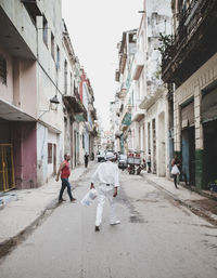 People walking on street in city