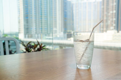 Glass of drink on table