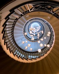 Directly below shot of illuminated spiral staircase