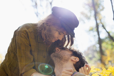 Happy young couple kissing in a park