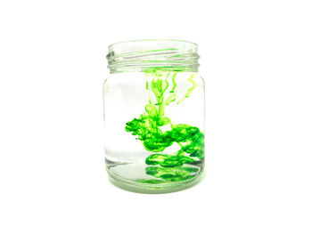 Close-up of water in jar against white background