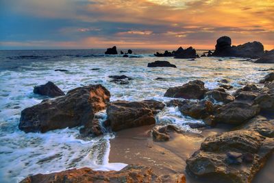 Scenic view of sea against sky during sunset