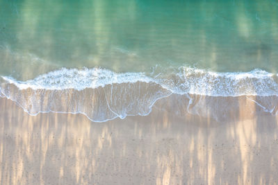 Close-up of icicles on sea shore