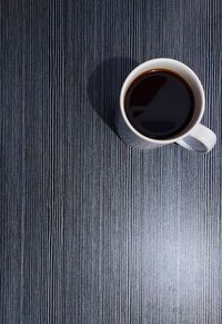 Directly above shot of coffee cup on table