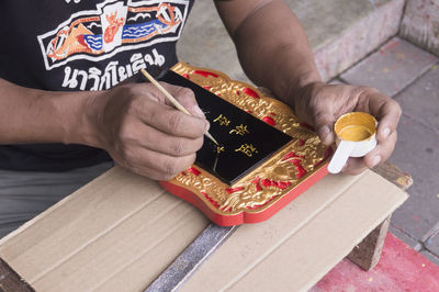 High angle view of man working on table