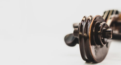 Close-up of machine part against white background