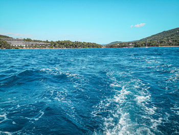 Scenic view of sea against blue sky