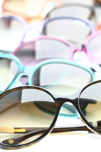 High angle view of various sunglasses on white background