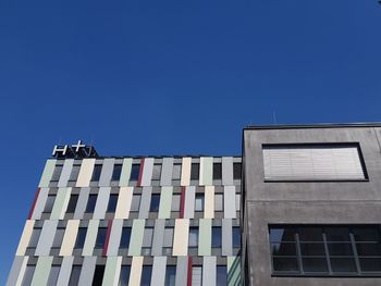 Low angle view of building against blue sky