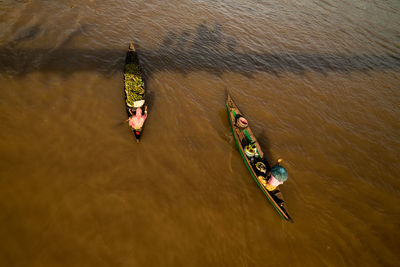 High angle view of floating market vendors in lake