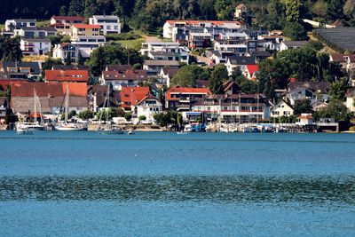 Scenic view of sea by town