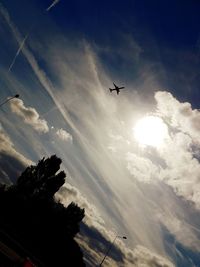 Low angle view of airplane flying in sky