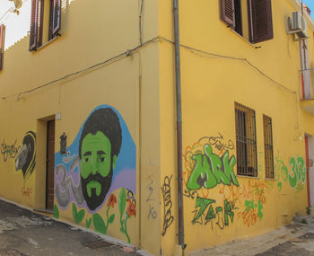 Graffiti on yellow wall