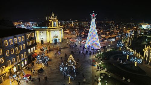 Illuminated buildings in city at night