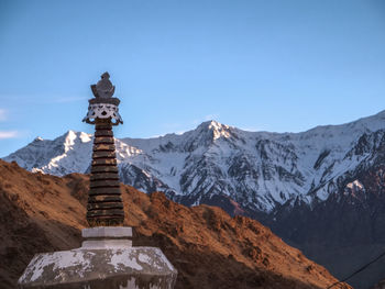 Scenic view of mountains against clear sky during winter