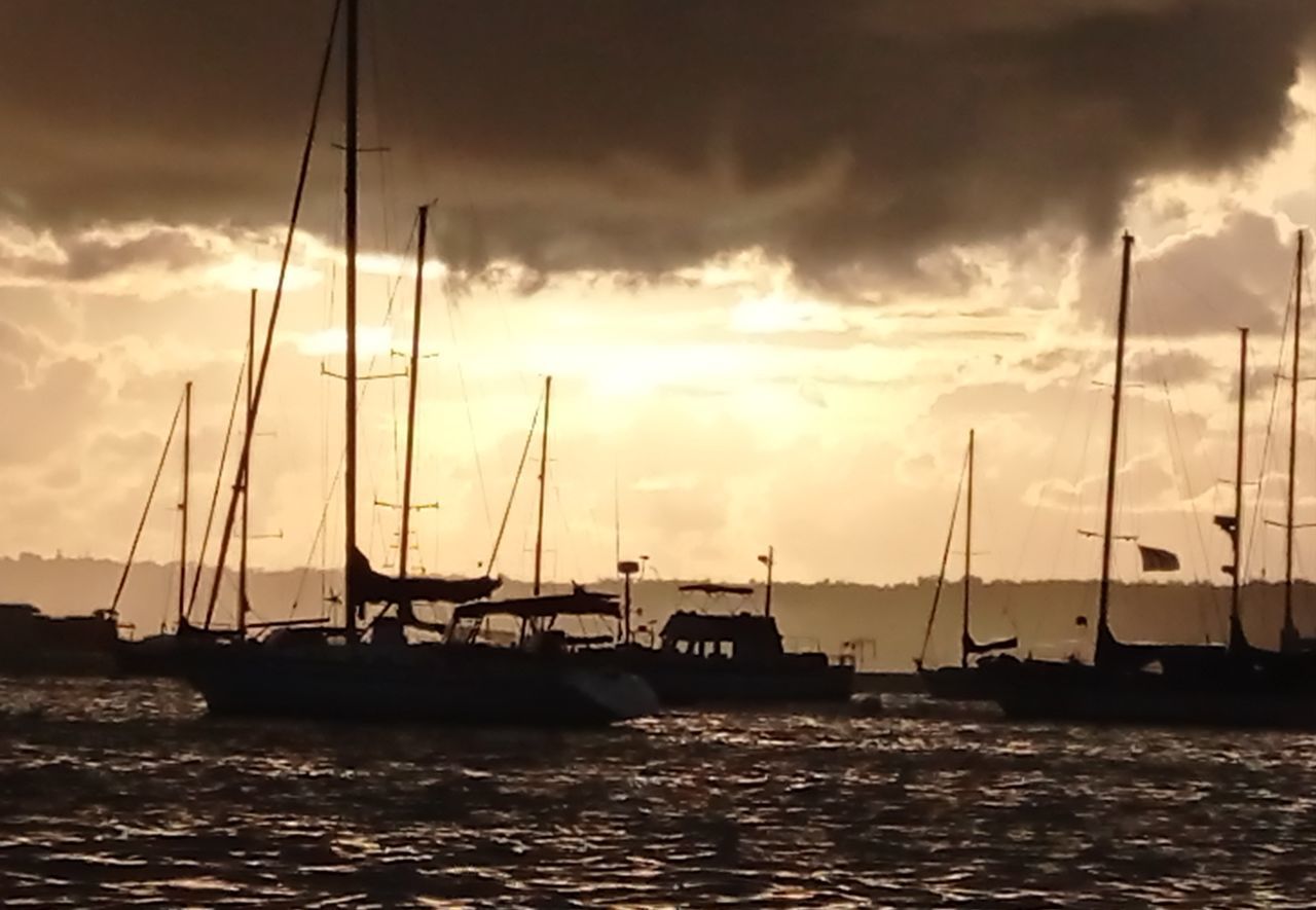 SAILBOATS IN SEA DURING SUNSET