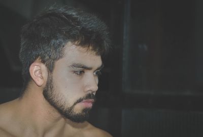 Portrait of young man looking away