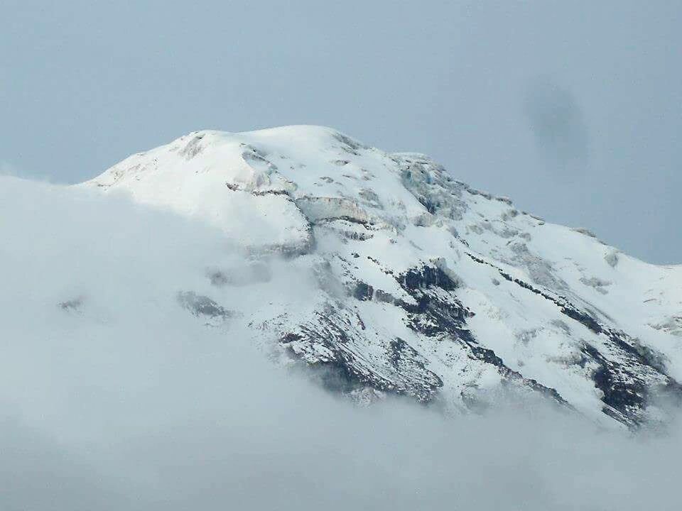 SNOW COVERED MOUNTAINS AGAINST SKY