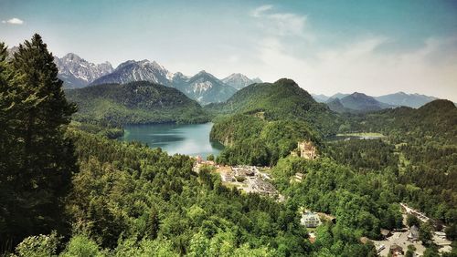 Scenic view of lake and mountains against sky