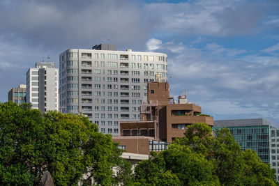 Buildings in city against sky