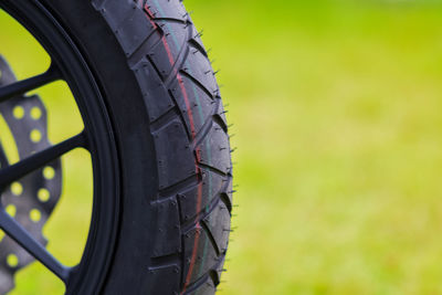 Close-up of tire tracks on field