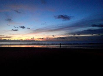 Scenic view of beach against sky during sunset