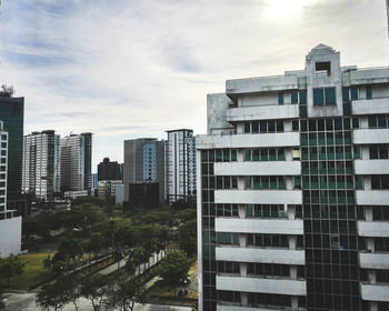 Buildings in city against sky