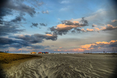 Scenic view of beach against sky during sunset