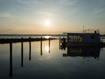 Scenic view of lake against sky during sunset