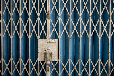 Full frame shot of closed metallic gate