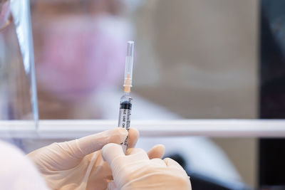 Midsection of person holding mobile phone