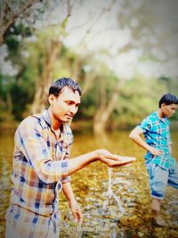 Man and boy standing outdoors