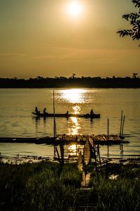 Scenic view of lake against sky during sunset