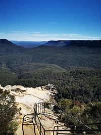 High angle view of landscape against blue sky