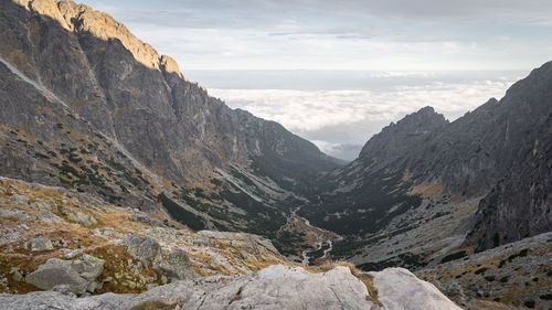 Beautiful view on alpine valley with big mountains and low clouds behind, slovakia, europe