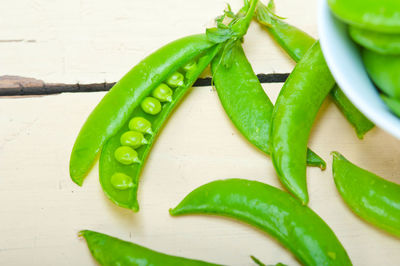 Close-up of red chili peppers on table