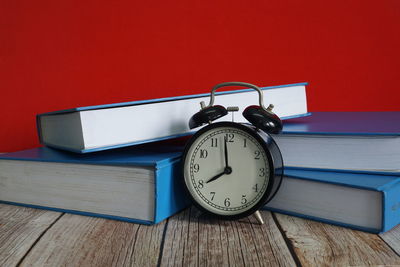 Close-up of clock on table