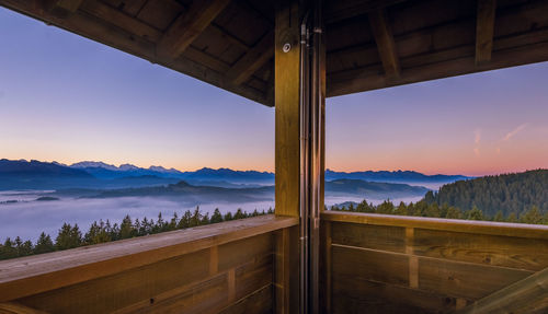 Scenic view of lake against sky at sunset