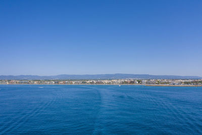 Scenic view of sea against clear blue sky