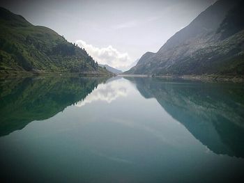 Reflection of trees in calm lake