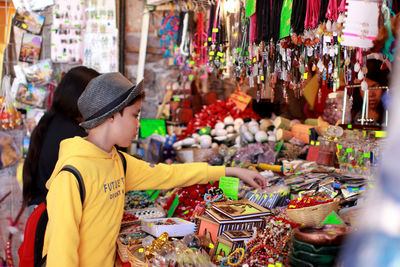 Boy shopping in city market