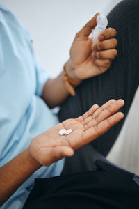 Midsection of doctor examining patient